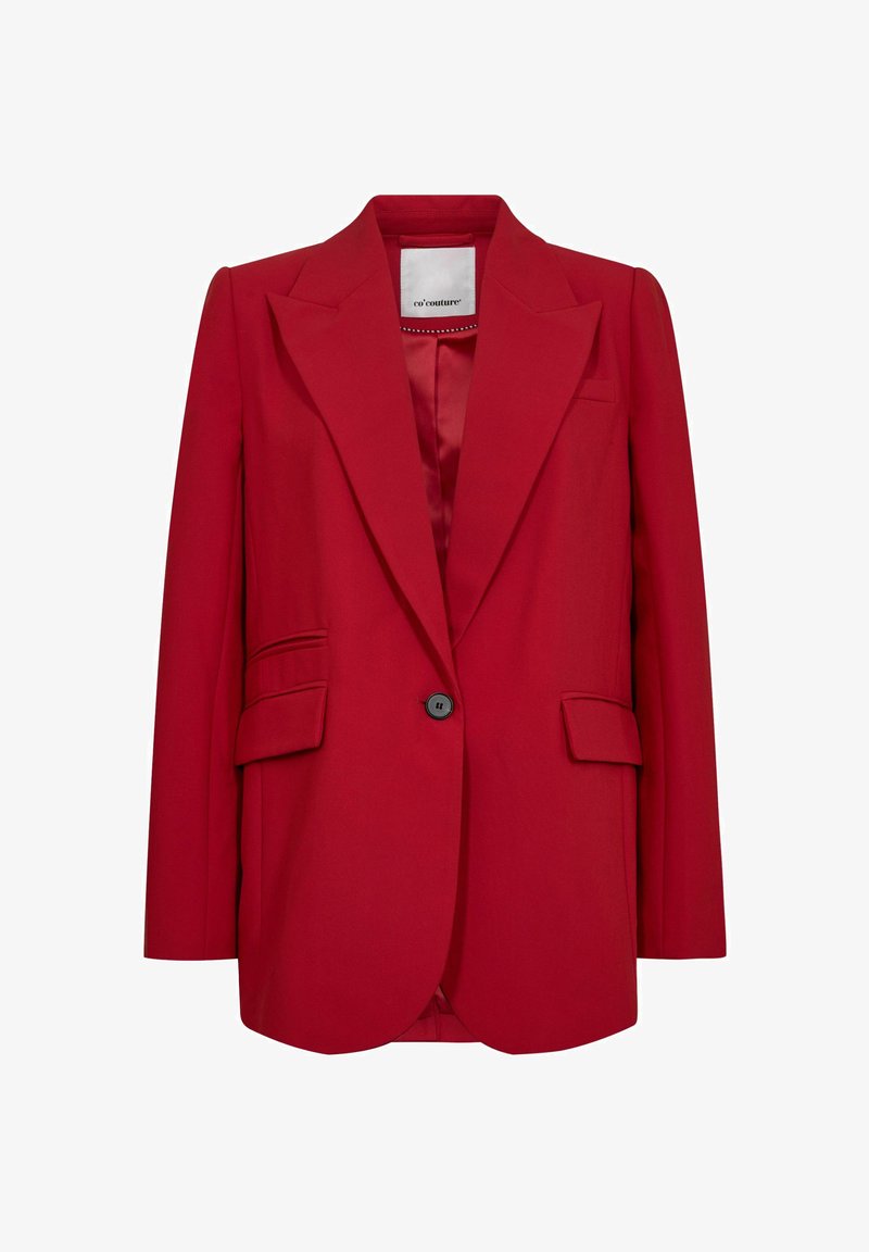 Sarkans bleizera, izgatavots no gludas auduma, ar plašu apkakli, vienu melnu pogu slēgšanu un divām sānu kabatām, ar pielāgotu piegriezumu.