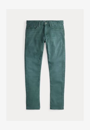 Zaļas kokvilnas džinsi ar šauru piegriezumu. Iespējas: divas priekšējās kabatas, rāvējslēdzēja aizdare un kontrastējoša šuvju krāsa. Gluda tekstūra, vienmērīga krāsa.