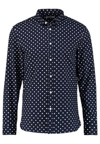Marineblauw blouse met witte stippen, lange mouwen en een kraag. Voorzien van knopen aan de voorkant en een gladde stoftextuur.