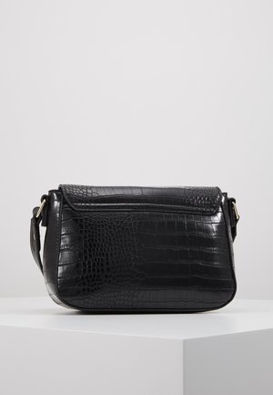 Black leather shoulder bag with crocodile texture, flap closure, and adjustable strap, displayed on a white pedestal against a plain background.