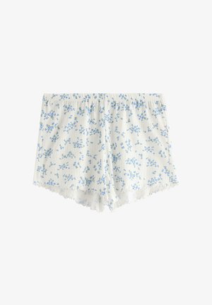Kukallinen yöshortsi, valmistettu kevyestä kankaasta, jossa on valkoinen tausta ja pieniä sinisiä kukkia sekä hieno pitsireuna helma.