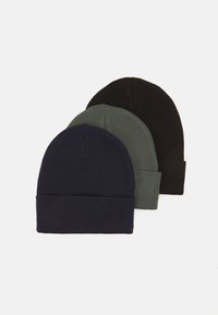 Three knit beanies in navy, olive green, and black, showcasing a simple design with a folded cuff and textured fabric.