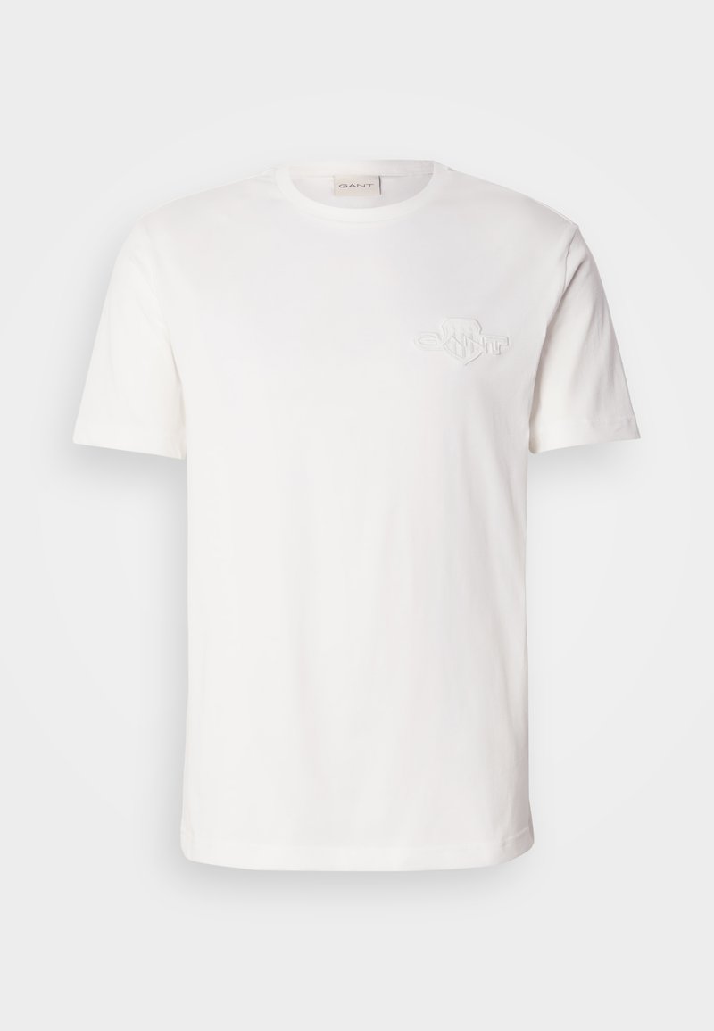 Weißes Baumwoll-T-Shirt mit kurzen Ärmeln, das ein dezentes geprägtes Logo auf der Brust trägt. Klassisches Rundhalsausschnitt-Design, glatte Textur.