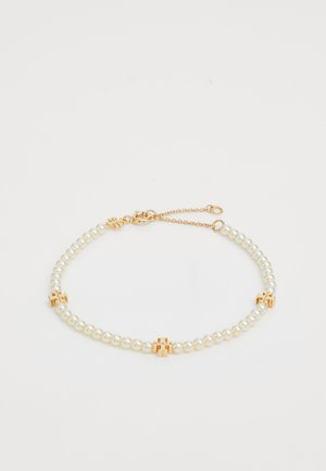 Pearl bracelet featuring a double strand of white pearls, accented with gold-toned hardware at intervals and a secured clasp closure.