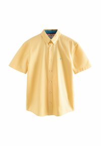 Camisa de botones de manga corta en algodón amarillo claro con un pequeño logotipo de palmera azul en el lado izquierdo del pecho y un interior de cuello estampado.
