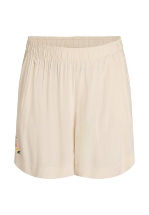 Cremefarbene Shorts mit elastischem Bund, verziert mit gestickten Blumenakzenten auf der linken Seite und einer glatten, leichten Textur.