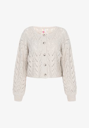 Heegeldatud, lühendatud kardigan helesbees. Omab tekstuurset pitsimustrit, ümmargust kaelust ja esipaneelil nuppe. Pikad varrukad ribakantidega.