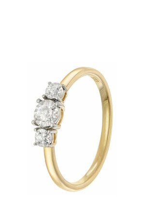 Gold band ring with three round clear diamonds set in white metal prongs, arranged with one larger center stone and two smaller side stones.