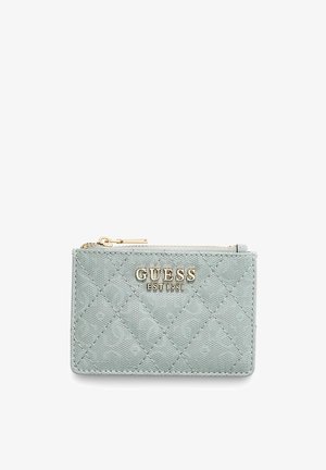 Light blue quilted cardholder made of synthetic material, featuring a gold-tone "GUESS EST 1981" logo and a zip closure.