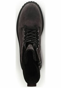 Black leather ankle boot features a rounded toe, lace-up front, and side zipper. The interior is lined with soft fabric for added comfort.