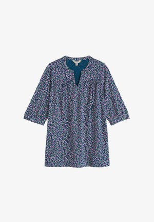 Tunique à motif floral avec manches trois-quarts, dotée d'un décolleté en V. Couleurs comprenant bleu marine avec des accents roses et verts. Tissu léger.