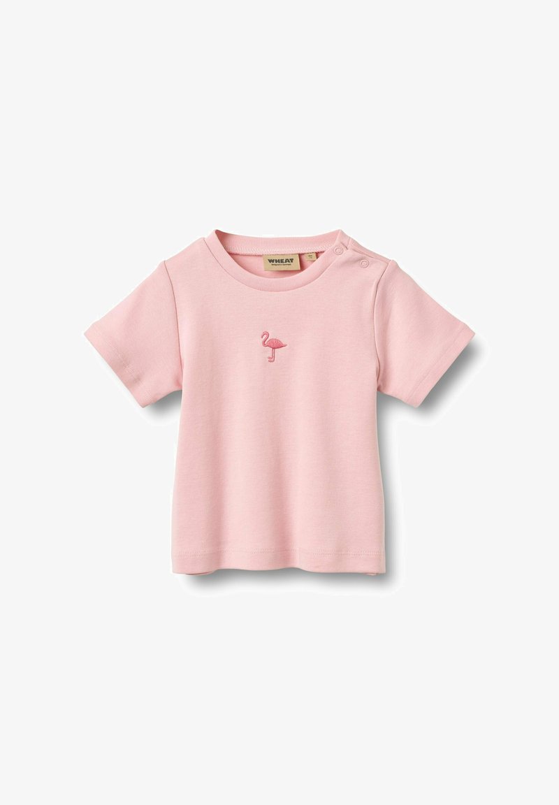 T-shirt bébé à manches courtes rose pâle avec un petit flamant rose brodé sur la poitrine et des boutons-pression sur l'épaule.