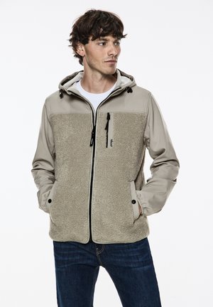 Beige Kapuzenjacke mit einer weichen, strukturierten Fleece-Front und glatten, dezenten Ärmeln. Verfügt über Reißverschlusstaschen und eine verstellbare Kapuze.