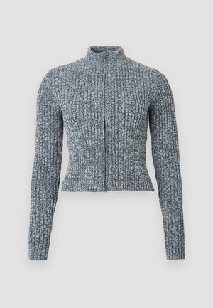 Blå ribbestrikket genser med glidelås, høy krage og tettsittende silhuett. Laget av teksturert strikket stoff; langermet med tettsittende mansjetter.