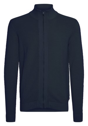 Morska zip-up pulover s rebrasto teksturo, visokim ovratnikom in prilegajočimi manšeti. Ima osrednji zadrgo in čist, minimalističen dizajn.