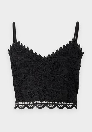 Czarny koronkowy biustonosz w kwiatowy wzór, z falbankami, regulowanymi ramiączkami i teksturowanym materiałem. Lekka i dopasowana konstrukcja.