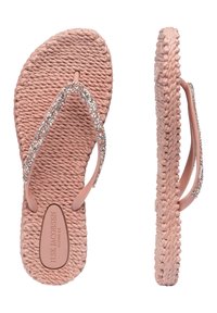 Růžové žabky s tkaným vzorem, vybavené třpytivým, průhledným strapcem z rhinestone. Měkký materiál, plochá podrážka a značka vyražená na stélce.