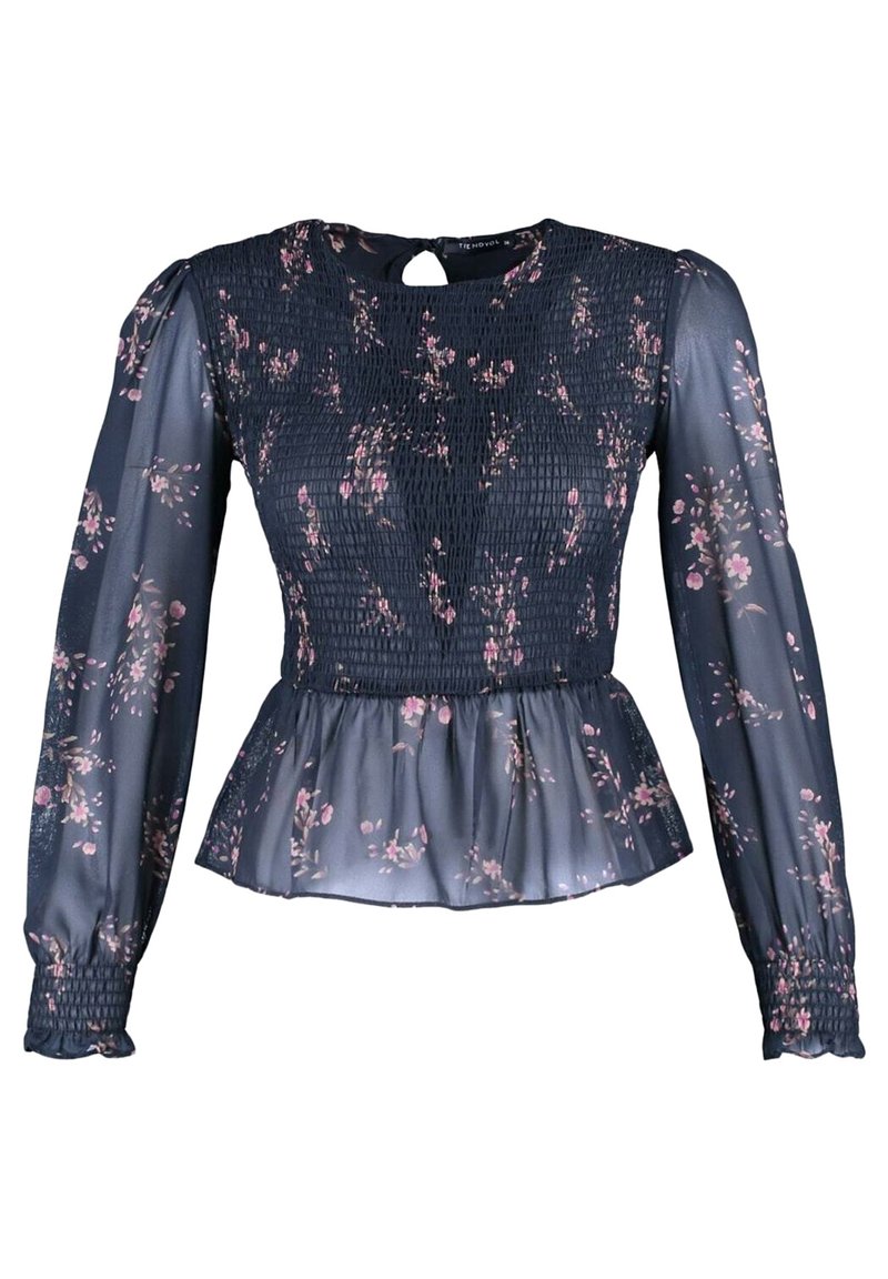 Marinebluse med lange smockærmer, blomsterprint i pink og creme, peplumkant, nøglehulslukning bagpå og gennemsigtigt materiale.