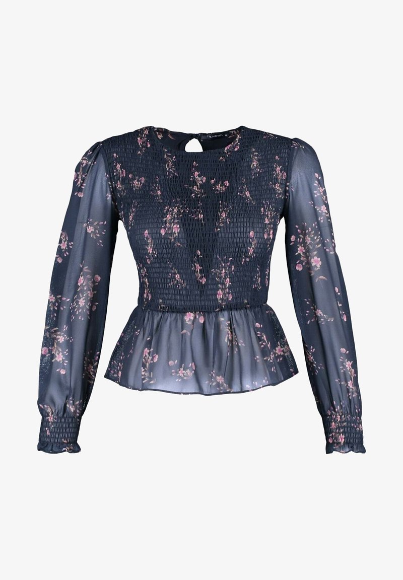 Marinebluse med lange smockærmer, blomsterprint i pink og creme, peplumkant, nøglehulslukning bagpå og gennemsigtigt materiale.