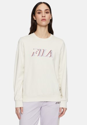 Crème-kleurige sweatshirt gemaakt van zachte stof met een grafische "FILA" logo in rood en paars. Lange mouwen en aansluitende manchetten.