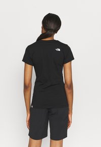 The North Face EASY - Potiskana majica - black