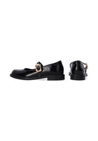 Black patent leather Mary Jane shoes with a chunky sole, featuring a wide front strap and a gold buckle accent. Smooth texture, rounded toe.