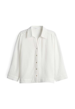 Camicia bianca con bottoni realizzata in tessuto leggero con finitura testurizzata. Presenta un colletto, maniche lunghe e sei chiusure a bottone sul davanti.