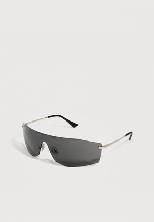 Sleek black wraparound sunglasses with single dark lens and thin silver-tone arms with black tips, set against a white background.