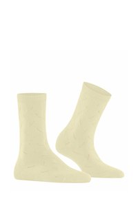 Para beżowych skarpetek sięgających do połowy łydki z subtelnym wzorem dzianym, zawierającym małe, rozproszone ażurowe detale na białym tle.