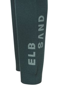 Green knitted joggers with soft texture, featuring large light grey letters "ELB" and "SAND" on the lower leg.