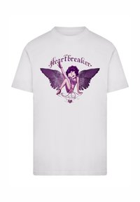 White cotton t-shirt featuring a purple illustration of a winged character with the text "#Heartbreaker" above and decorative swirls below.