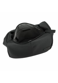 Sac en cuir noir à la forme arrondie, doté d'une fermeture éclair et d'un intérieur en tissu gris. Texture lisse avec des accents matériels minimaux.