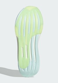 Schoenzool met een gradient van lichtgroen en blauw. Beschikt over gestructureerde horizontale en verticale groeven, wat de grip en flexibiliteit verbetert.