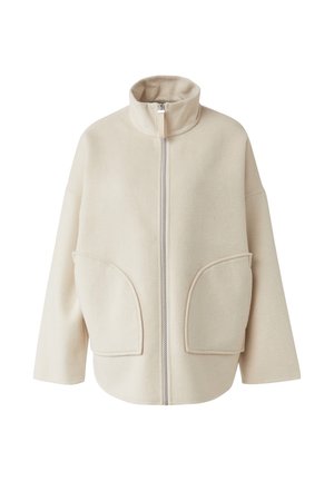 Beige fleece jacket with high collar, front zipper, and two large patch pockets. Features a relaxed fit and soft texture.