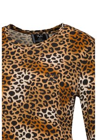 Langarmhemd mit Leopardenmuster in Braun, Schwarz und Creme. Mit rundem Ausschnitt und Logo auf der Brust. Hergestellt aus weichem Stoff.