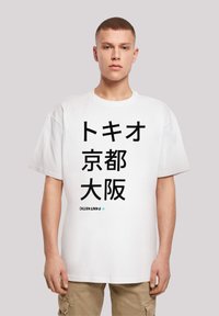 White cotton t-shirt with a loose fit, featuring black Japanese text and the word "FANTASTIC" in a smaller, blue font at the bottom.