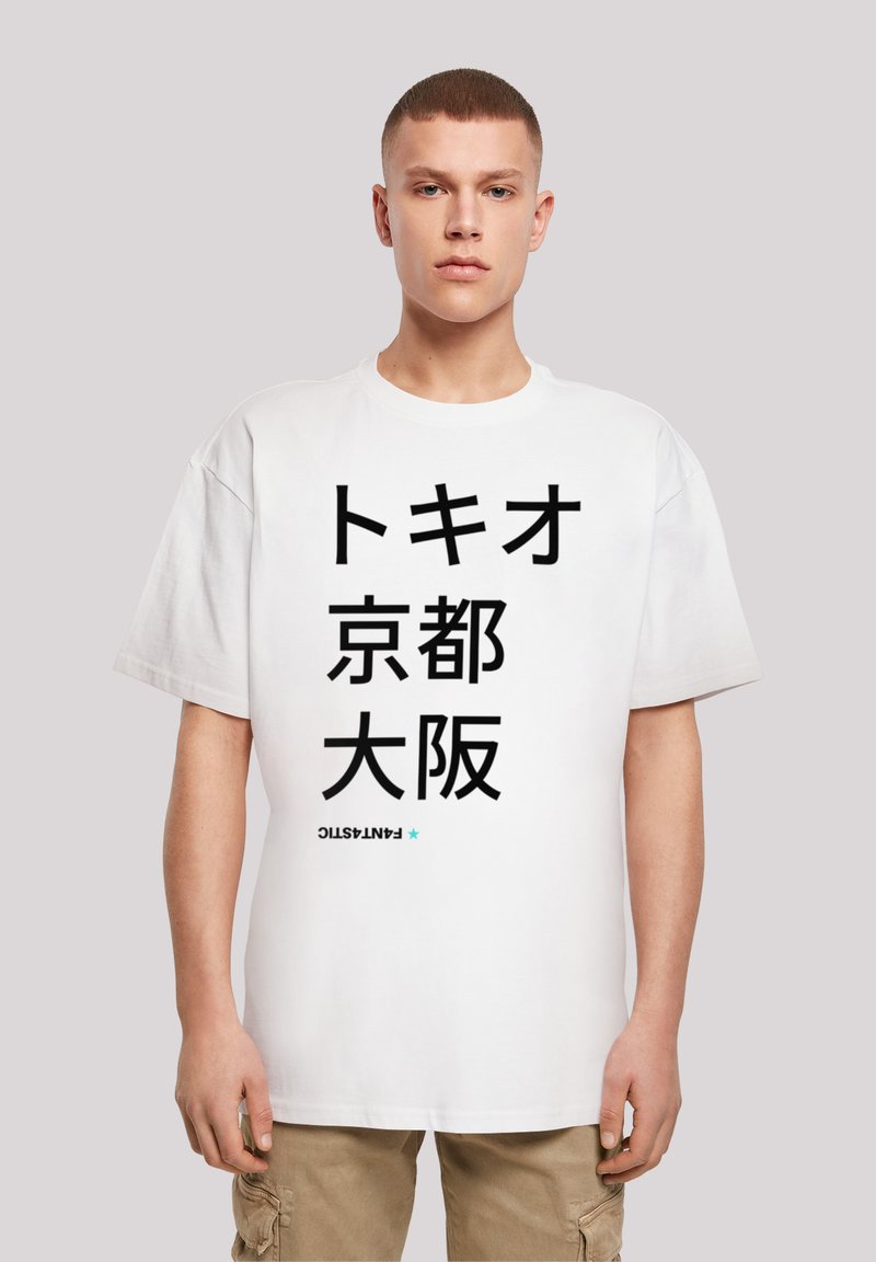 White cotton t-shirt with a loose fit, featuring black Japanese text and the word "FANTASTIC" in a smaller, blue font at the bottom.