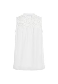 Blouse blanche sans manches avec empiècement en dentelle fleurie au dos et une coupe ample et fluide sous cet empiècement.
