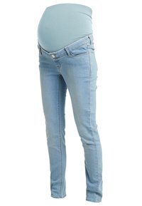 Těhotenské skinny džíny světle modrého denimu s pružným pasem pro podporu. Obsahují design se šesti kapsami a lehkým opotřebením.