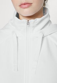 Athleta TRIUMPH HOODIE - Camisola com fecho - white