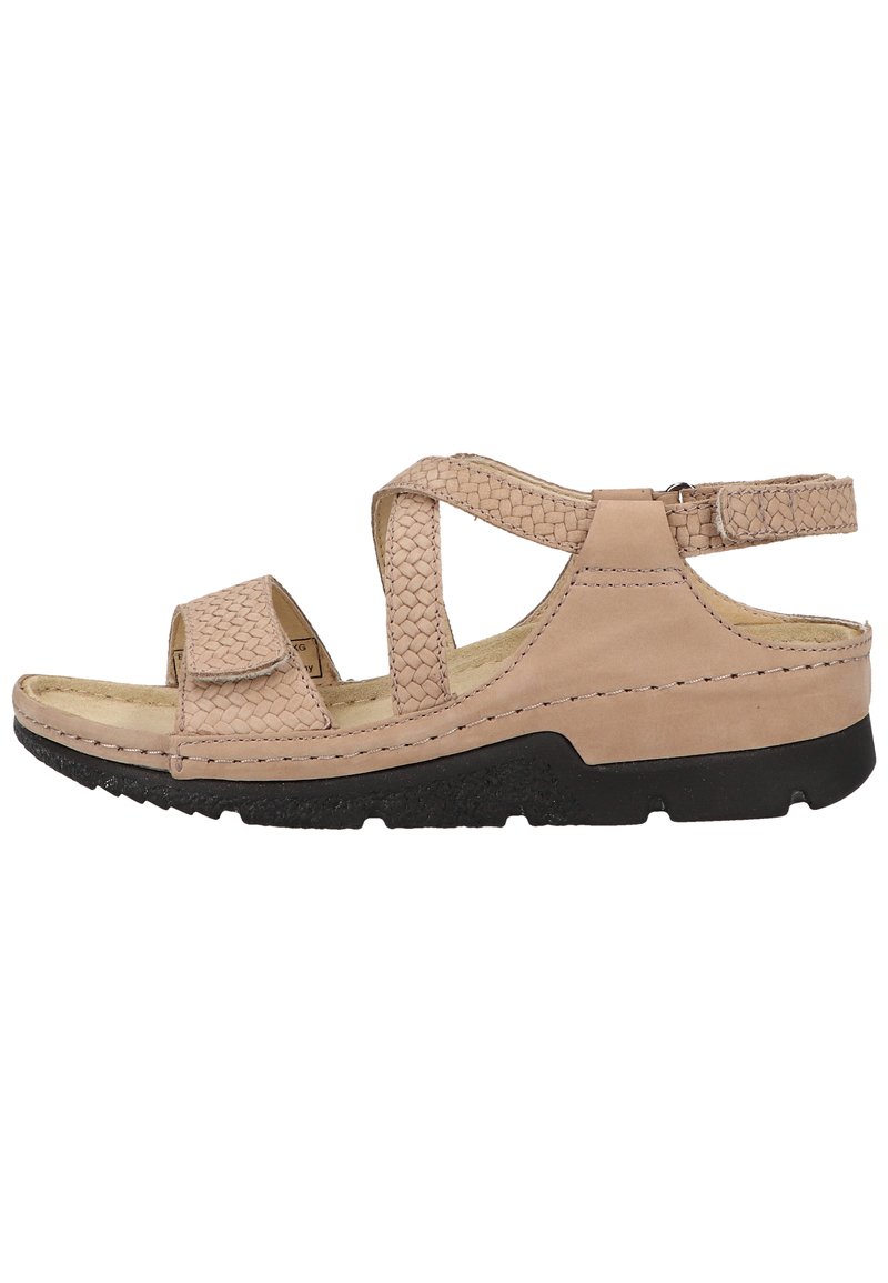 Beige leather sandal with woven straps, adjustable ankle closure, cushioned footbed, and black rubber sole for grip.