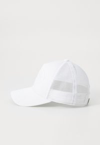 White baseball cap with a curved visor, soft fabric front, and mesh rear panels. Features a circular logo on the front.