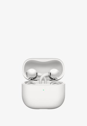 White wireless earbuds with shiny metallic finish inside an open white textured charging case with a green LED indicator light.