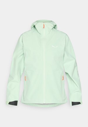 Giacca impermeabile verde menta con zip frontale, due tasche laterali con hardware arancione e dettagli neri ai polsini.