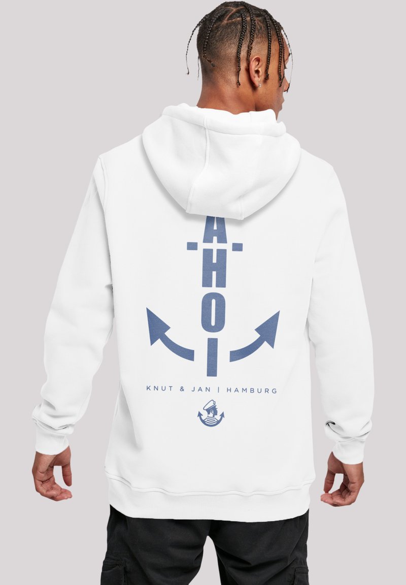 White hooded sweatshirt featuring a navy blue graphic of the word "AHOI" and an anchor design on the back. Soft fabric and relaxed fit.