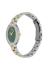 Orologio in metallo argentato e dorato con quadrante verde, marcatori delle ore dorati bold e cassa rotonda con cinturino testurizzato. Include un fermaglio regolabile.