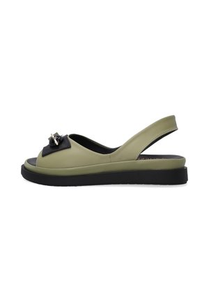 Green leather slingback sandals with black accent, open toe, rounded shape, and a low black sole, featuring a decorative bow detail.