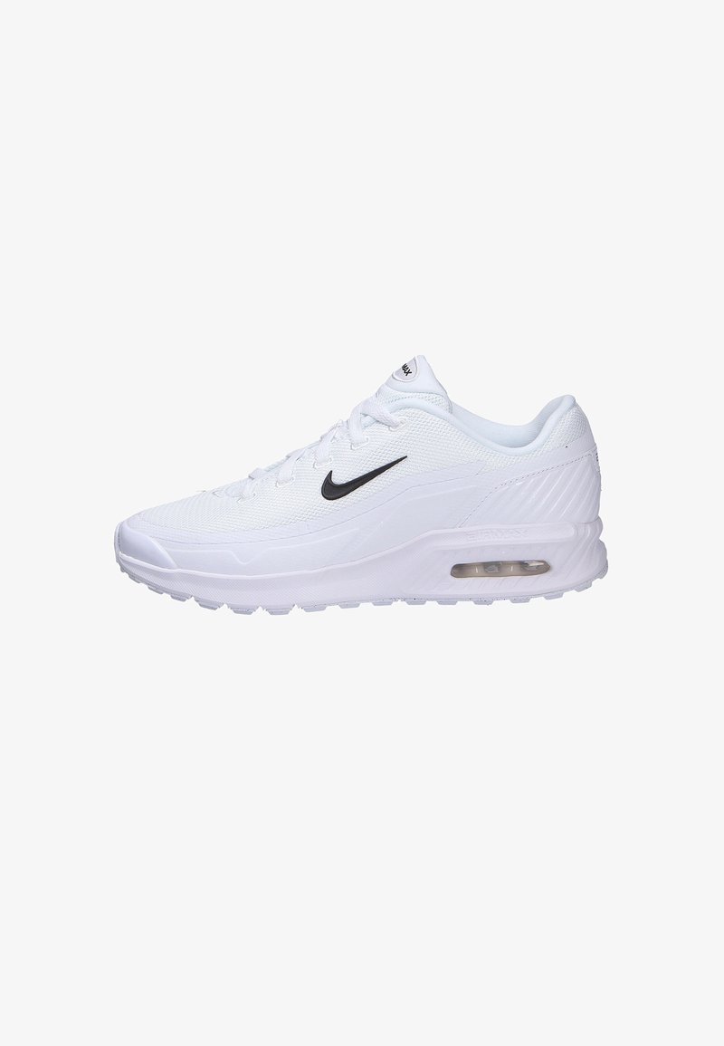 Zapatilla deportiva blanca con parte superior de malla texturizada, logo Swoosh negro y unidad de aire visible en la suela. Punta redondeada y cuello acolchado.