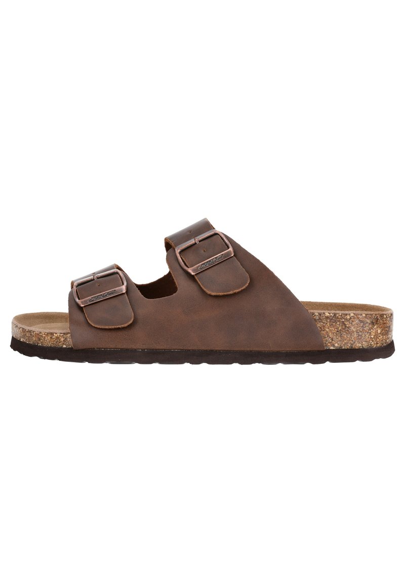 Sandales en cuir marron avec deux boucles réglables, semelle en liège et semelle en caoutchouc noire. Présente un design minimaliste et une forme plate.