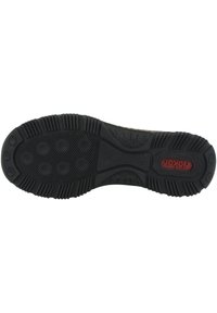 Soletta in gomma nera con motivo testurizzato per la presa, con lugs circolari e rettangolari, e accento del logo rosso "Fjällräven".